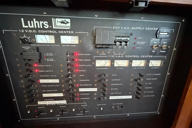  Yacht Photos Pics Control panel of a 2005 Luhrs 38 Convertible boat, featuring electrical systems and switches.
