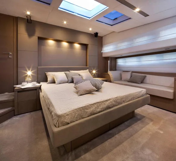  Yacht Photos Pics Luxurious bedroom interior of 2016 Prestige 750 yacht with skylights and elegant decor.