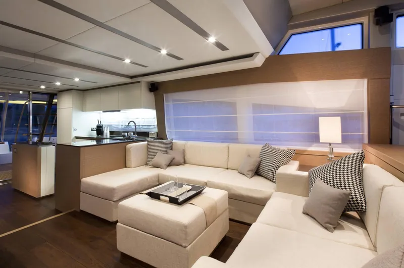  Yacht Photos Pics Luxurious interior of 2016 Prestige 750 yacht with modern kitchen and cozy seating area.