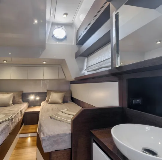  Yacht Photos Pics Luxurious 2016 Prestige 750 yacht cabin with twin beds and modern decor.