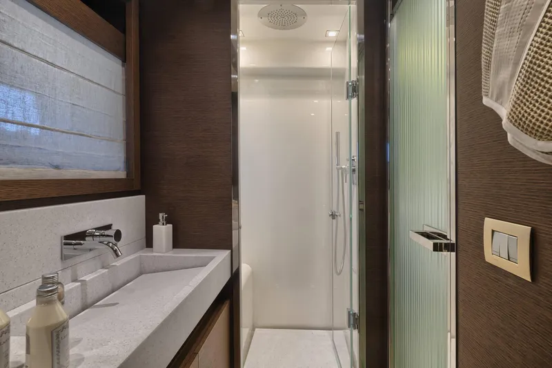  Yacht Photos Pics Luxurious bathroom in 2016 Prestige 750 yacht with modern shower and sleek design.