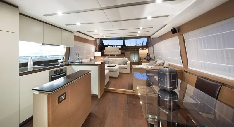  Yacht Photos Pics Luxurious interior of 2016 Prestige 750 yacht with modern kitchen and elegant seating area.