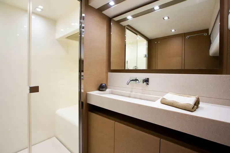  Yacht Photos Pics Luxurious bathroom in 2016 Prestige 750 yacht with modern fixtures and elegant design.