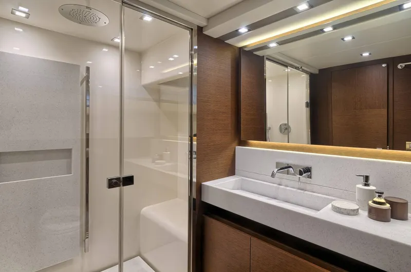  Yacht Photos Pics Luxurious bathroom in 2016 Prestige 750 yacht with modern fixtures and elegant design.