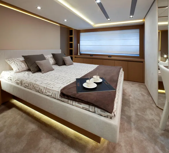  Yacht Photos Pics Luxurious bedroom interior on 2016 Prestige 750 yacht, featuring modern design and elegant decor.