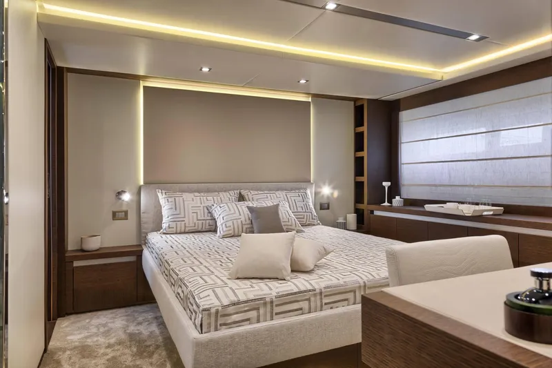  Yacht Photos Pics Luxurious bedroom interior of 2016 Prestige 750 yacht with modern design and ambient lighting.