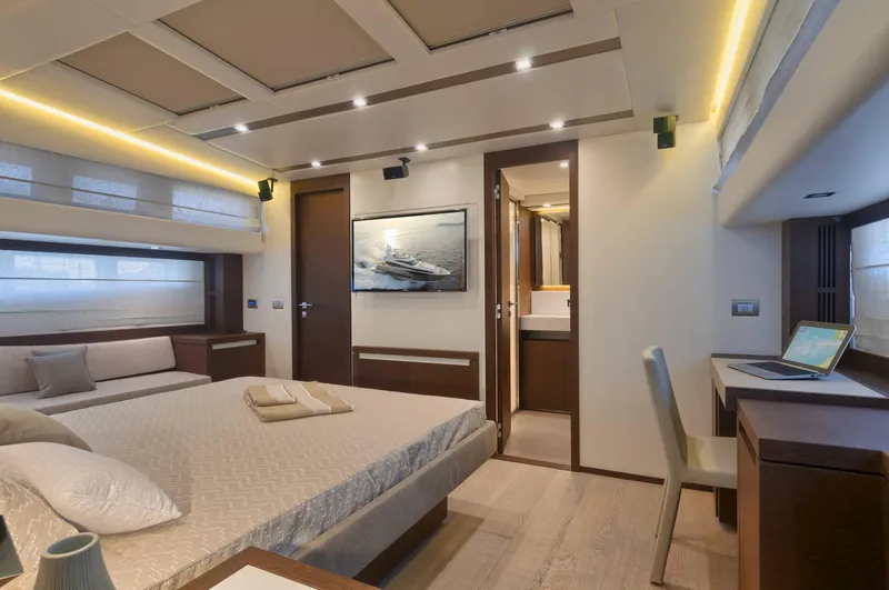  Yacht Photos Pics Luxurious interior of 2016 Prestige 750 yacht bedroom with modern decor and ambient lighting.