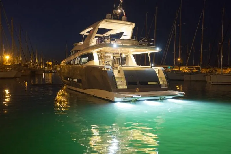  Yacht Photos Pics Prestige 750 yacht, 2016 model, illuminated at night in a marina.