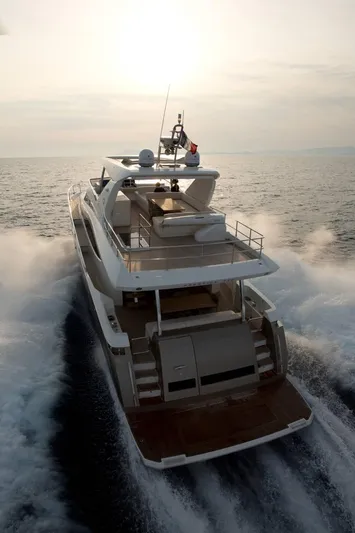  Yacht Photos Pics Luxury 2016 Prestige 750 yacht cruising on open sea at sunset.