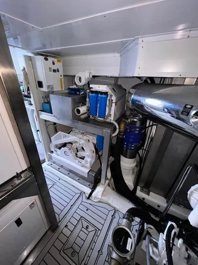  Yacht Photos Pics Engine room of 2016 Prestige 750 yacht with mechanical equipment and piping.