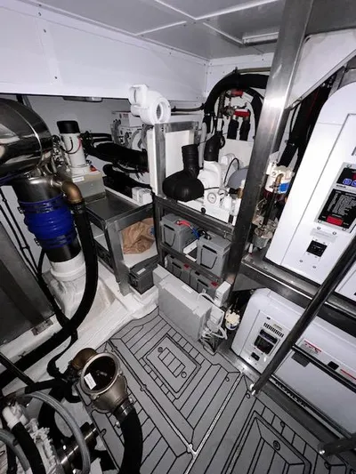  Yacht Photos Pics Engine room of 2016 Prestige 750 yacht with mechanical equipment and piping.