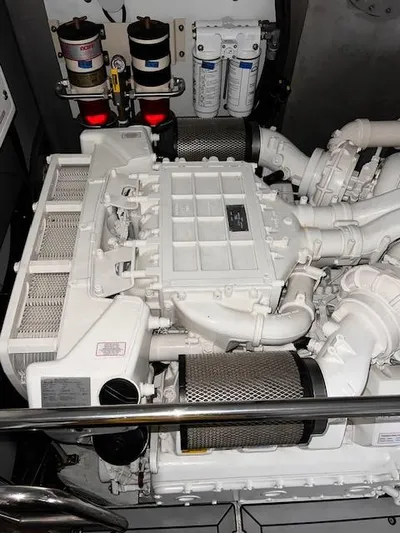  Yacht Photos Pics Engine room of a 2016 Prestige 750 yacht, showcasing mechanical components.