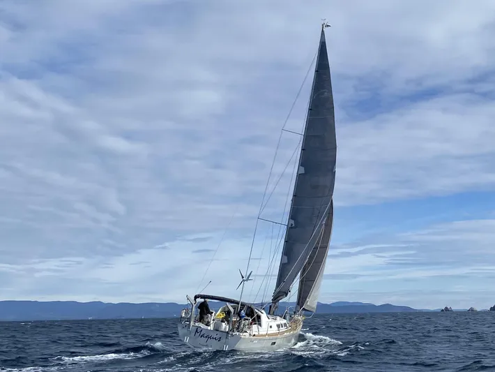 Maquis Yacht Photos Pics Sailing yacht Boreal 55 OC 2020 navigating open sea under cloudy sky.