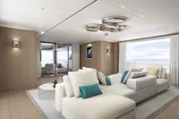 Luxurious yacht interior with modern design, featuring plush seating and ocean views. Tureddi X370, 2027.