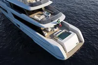Luxurious 2027 Tureddi X370 yacht with spacious decks and a jacuzzi, cruising on open water.