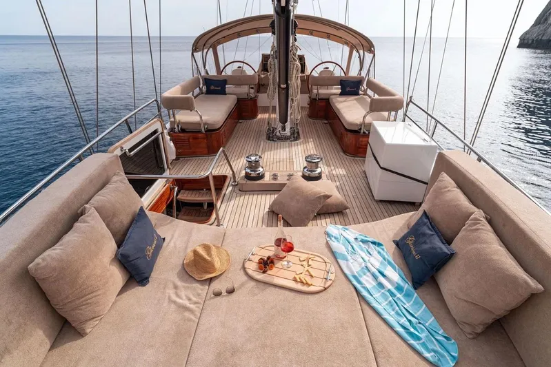  Yacht Photos Pics Luxurious 2012 Custom Motorsailor deck with plush seating, snacks, and ocean view.