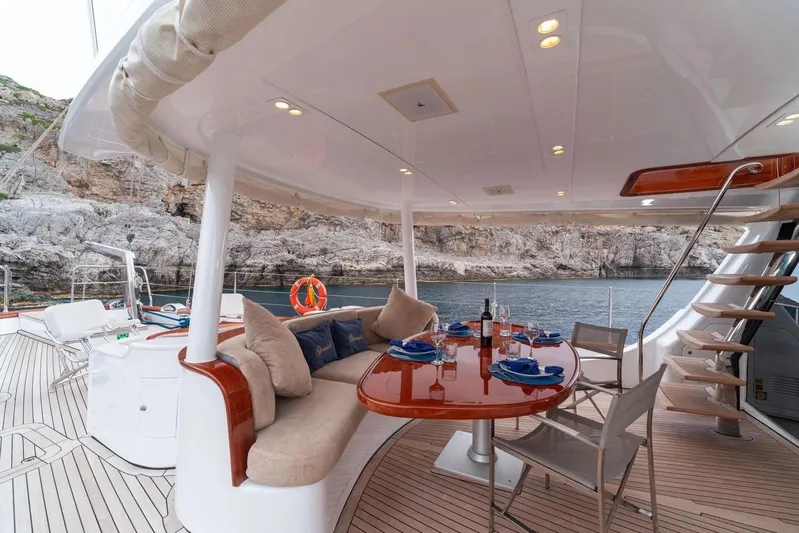  Yacht Photos Pics Luxurious 2012 Custom Motorsailor yacht deck with elegant dining area and scenic ocean view.