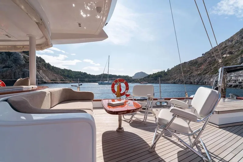  Yacht Photos Pics Luxurious 2012 Custom Motorsailor yacht deck with seating, table, and scenic ocean view.