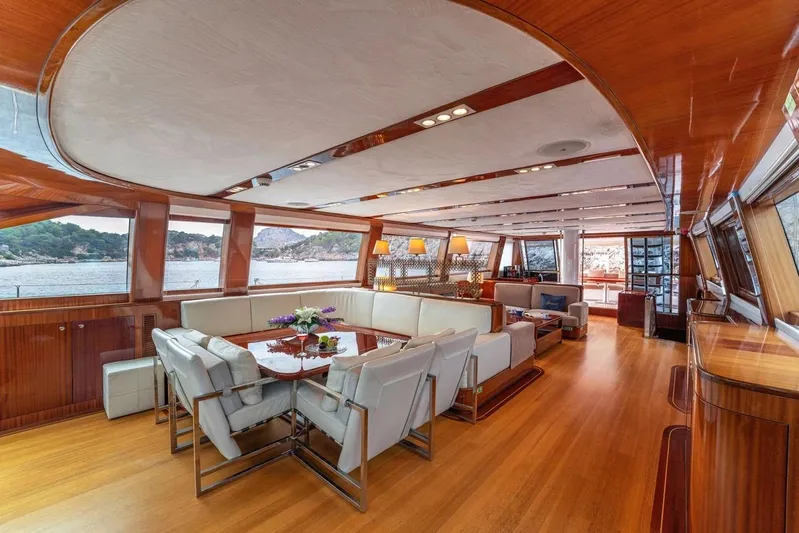  Yacht Photos Pics Luxurious interior of a 2012 Custom Motorsailor yacht with elegant wood finishes and spacious seating.