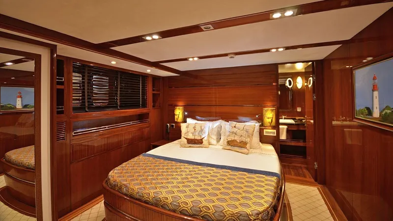  Yacht Photos Pics Luxurious bedroom interior on 2012 Custom Motorsailor yacht with elegant wood paneling.