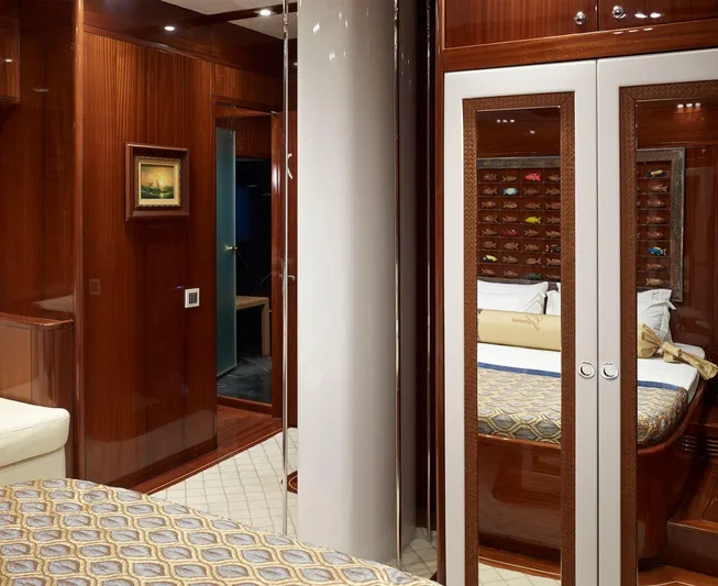  Yacht Photos Pics Luxurious cabin interior of 2012 Custom Motorsailor with elegant wood finishes and mirrored closet.