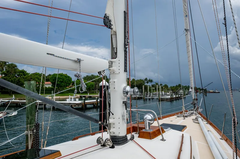 Ghost Yacht Photos Pics Hinckley Sou'wester Stoway Sloop 2000 sailboat docked, showcasing mast and rigging.