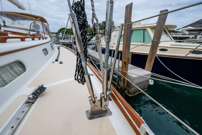 Ghost Yacht Photos Pics Hinckley Sou'wester Stoway Sloop 2000 docked, showcasing deck and rigging details.
