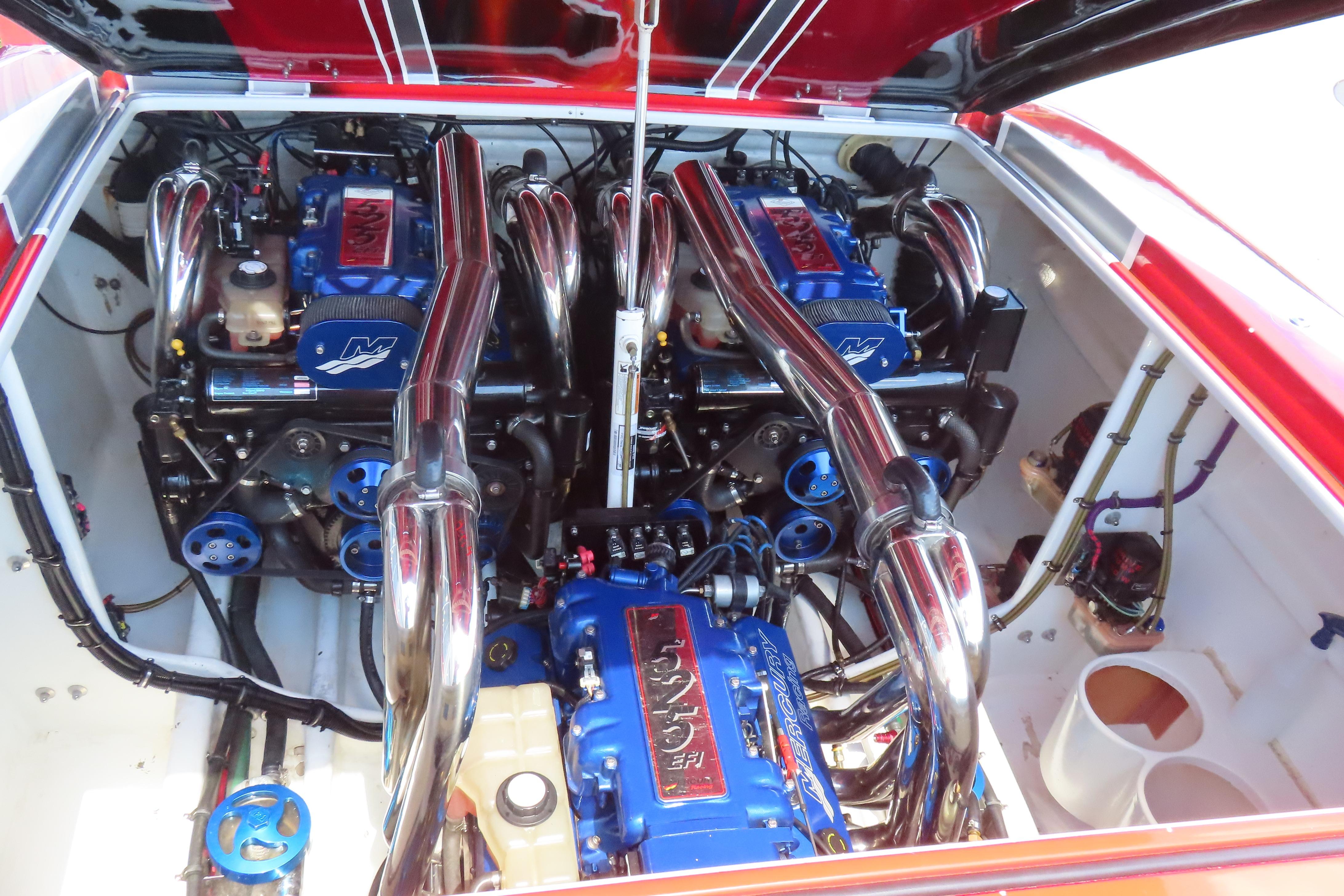 Engine compartment of a 2004 Outerlimits 42 Legacy boat with dual high-performance engines.