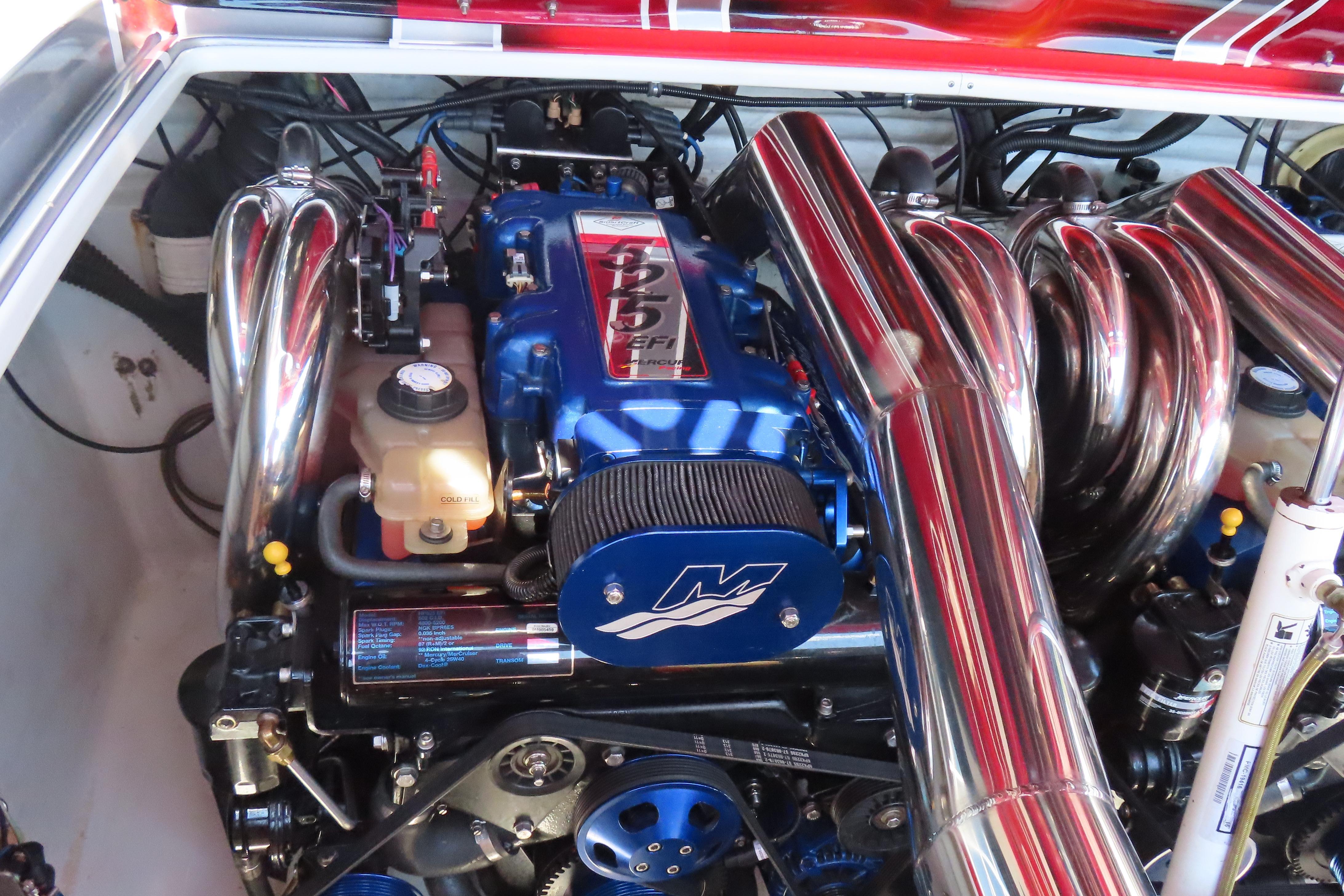 Engine of 2004 Outerlimits 42 Legacy boat with polished chrome components.