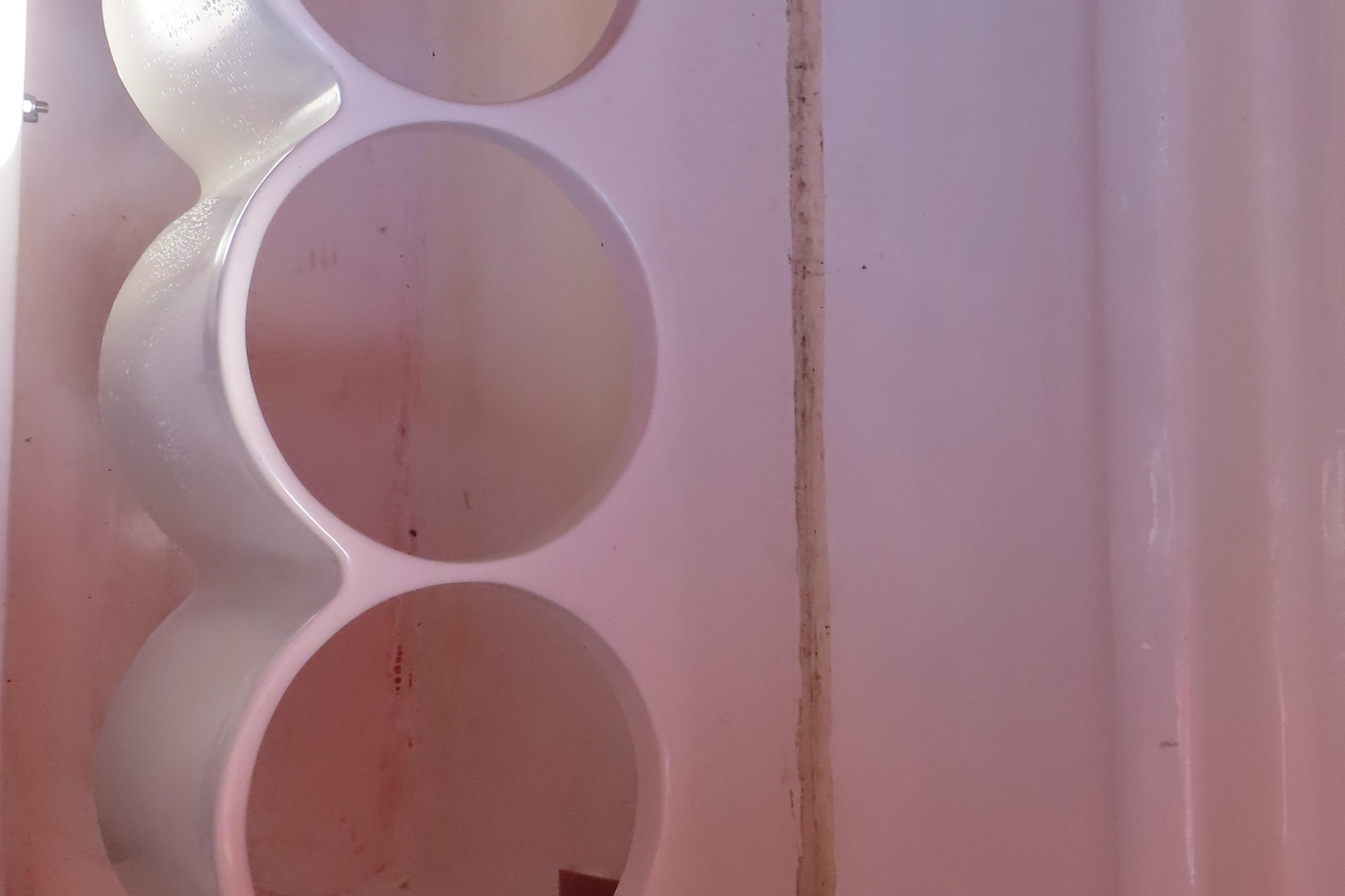 Cup holder detail in 2004 Outerlimits 42 Legacy boat interior.