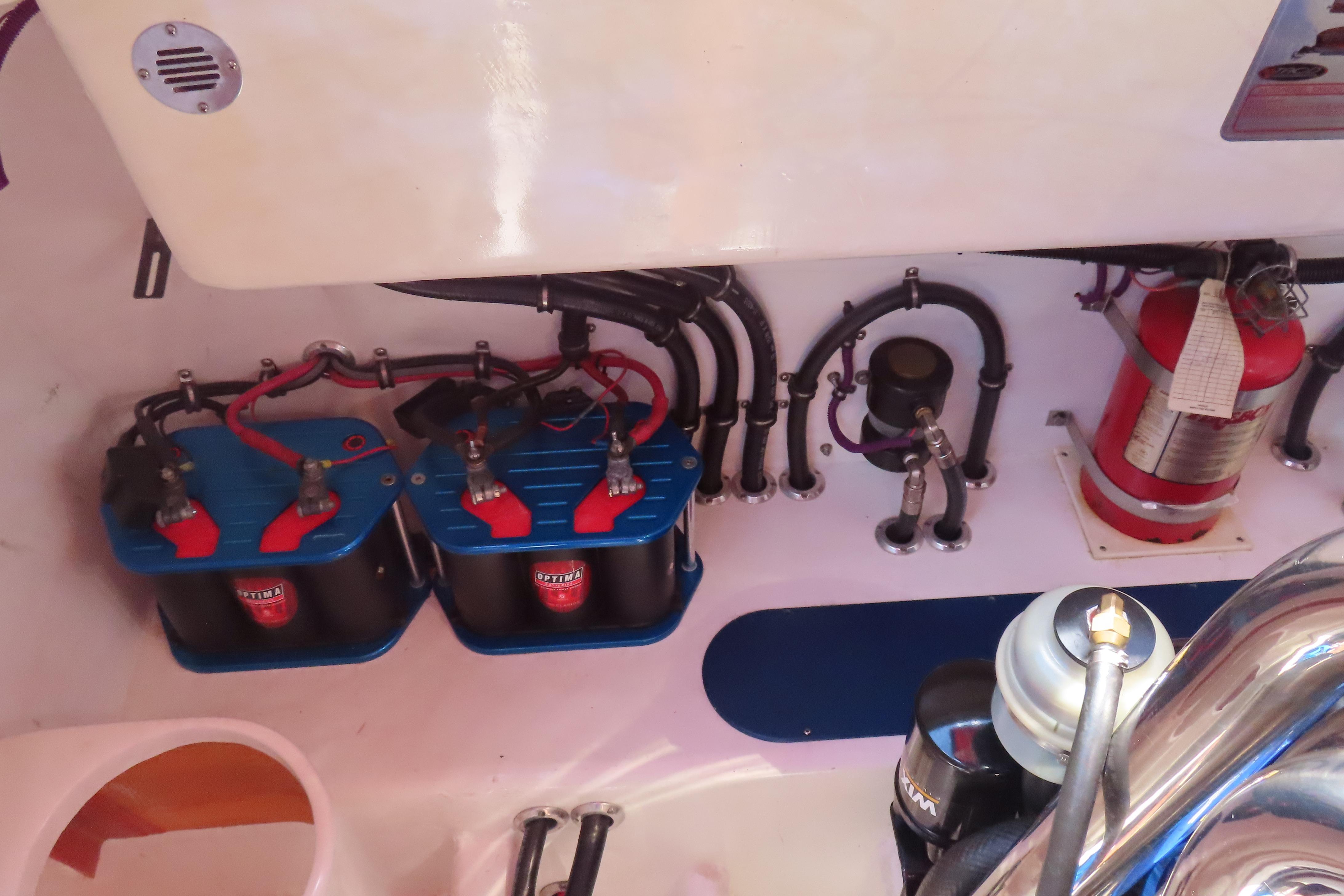 2004 Outerlimits 42 Legacy engine compartment with batteries and fire extinguisher.