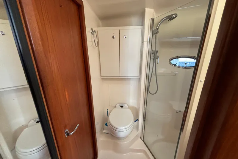  Yacht Photos Pics Bathroom interior of 2002 Tiara Yachts 4100 Open with shower and toilet.