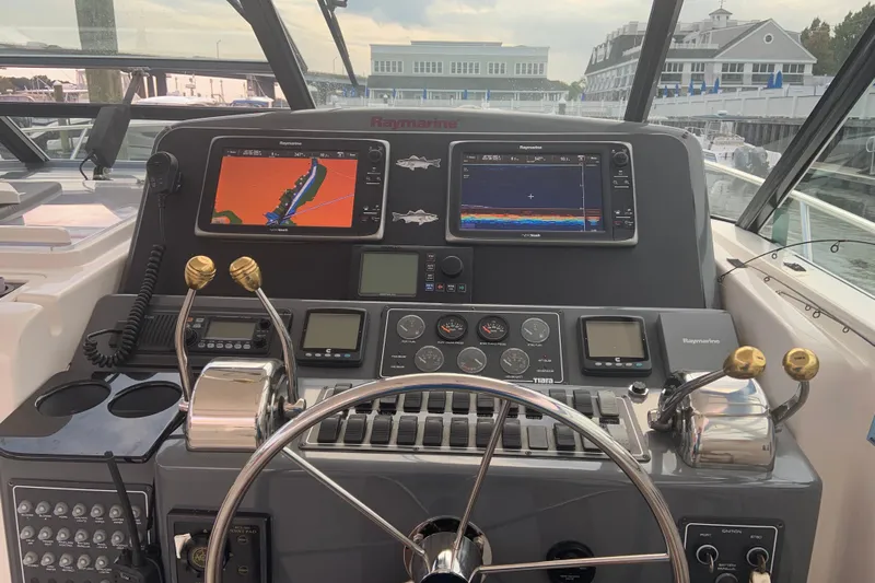  Yacht Photos Pics Helm of 2002 Tiara Yachts 4100 Open with navigation displays and controls.