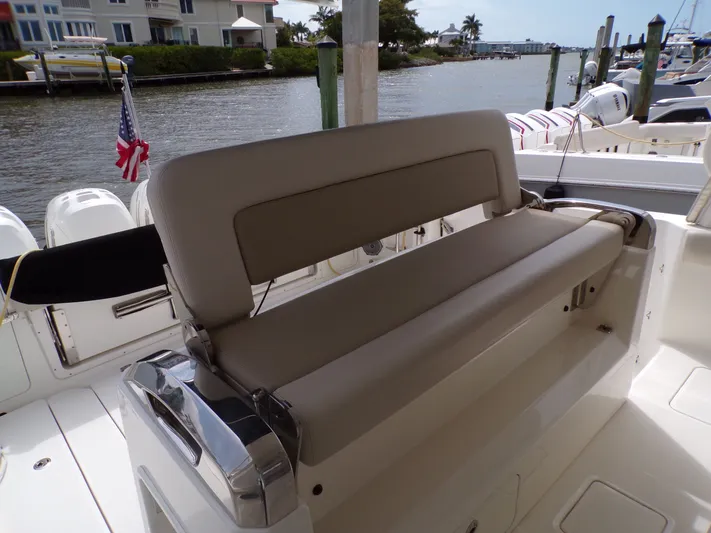  Yacht Photos Pics 2018 Boston Whaler 420 boat with beige seating by the water.