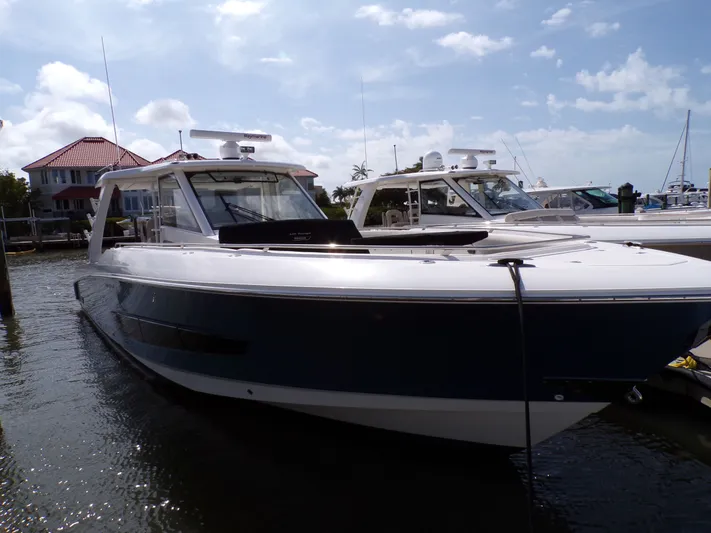  Yacht Photos Pics 2018 Boston Whaler 420 yacht docked in sunny marina.