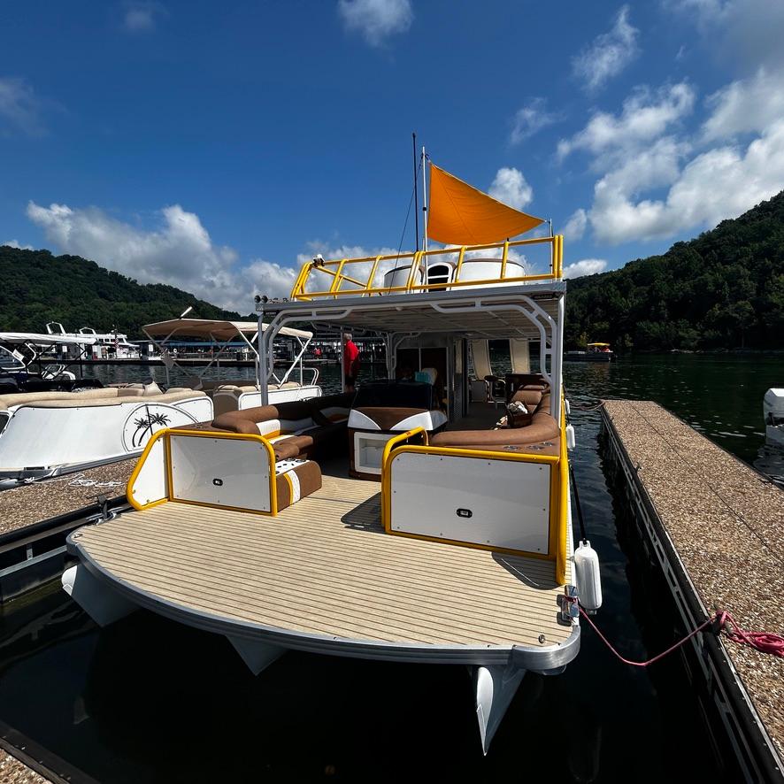 2025 Aloha Pontoon 40' Sky View docked on a sunny day.
