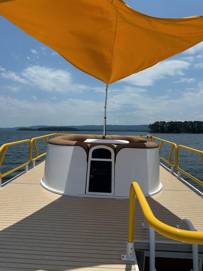 2025 Aloha Pontoon 40' Sky View with yellow canopy on a sunny day.