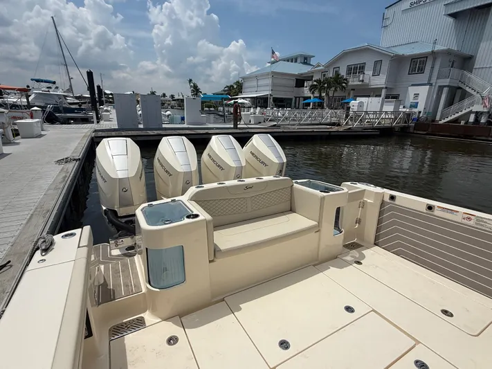  Yacht Photos Pics 2025 Scout 400 LXF boat docked, featuring four Mercury outboard engines.