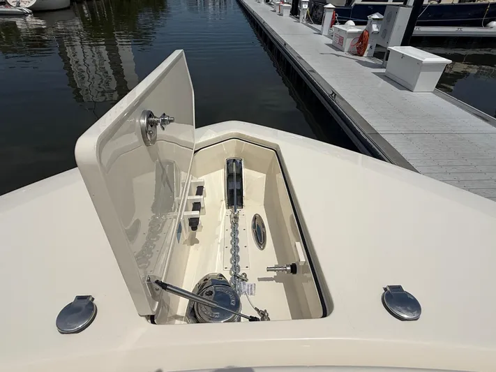  Yacht Photos Pics 2025 Scout 400 LXF boat anchor compartment at marina dock.