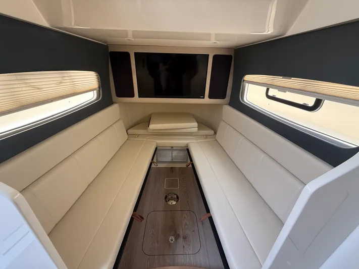  Yacht Photos Pics Luxurious interior of 2025 Scout 400 LXF boat with plush seating and modern design.