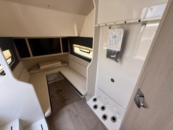  Yacht Photos Pics Luxurious interior of 2025 Scout 400 LXF boat with modern seating and sleek design.