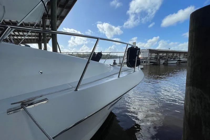 Aventis Yacht Photos Pics 1999 McKinna 57 Pilothouse yacht docked under blue sky.