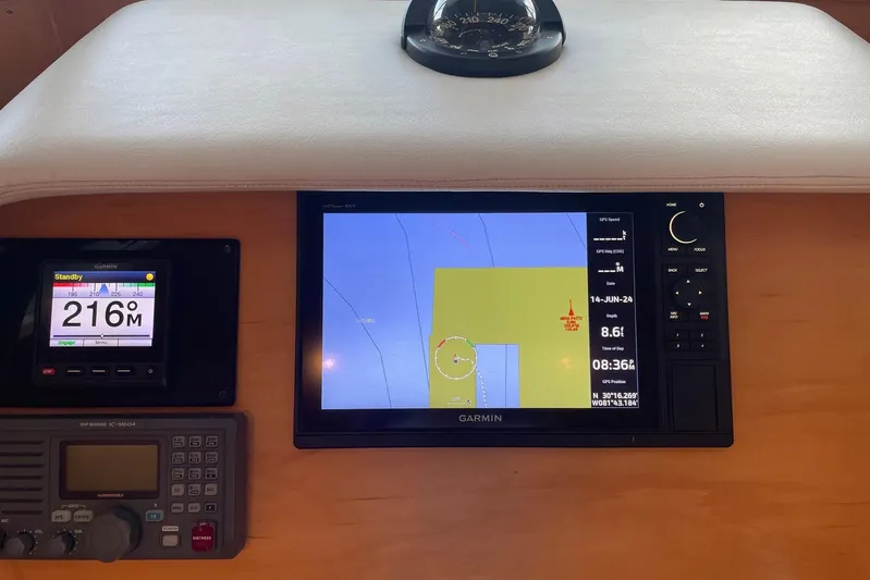 Aventis Yacht Photos Pics Navigation equipment on 1999 McKinna 57 Pilothouse, featuring Garmin displays and compass.