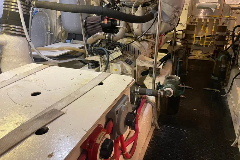 Aventis Yacht Photos Pics Engine room of a 1999 McKinna 57 Pilothouse yacht, showcasing mechanical components.