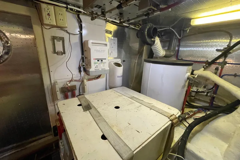 Aventis Yacht Photos Pics Engine room of a 1999 McKinna 57 Pilothouse yacht, featuring equipment and wiring.