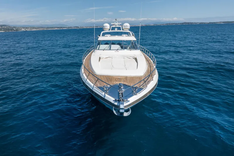  Yacht Photos Pics Luxury 2006 Mangusta 80 yacht cruising on open sea under clear skies.