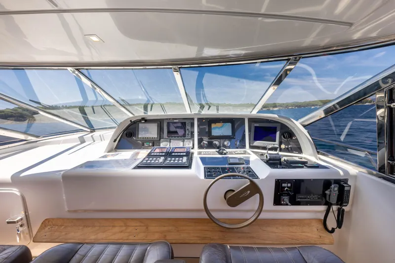  Yacht Photos Pics Cockpit of 2006 Mangusta 80 yacht with modern navigation equipment and panoramic sea view.