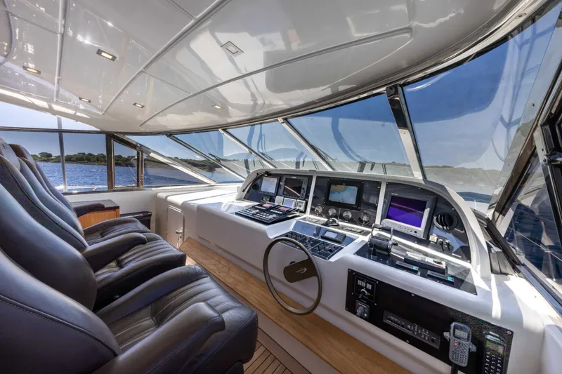  Yacht Photos Pics Luxurious 2006 Mangusta 80 yacht cockpit with leather seats and advanced navigation systems.
