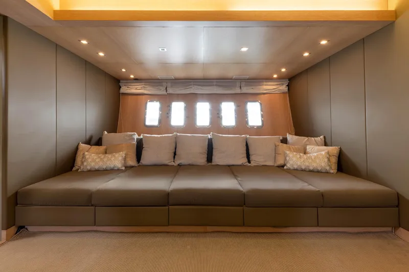  Yacht Photos Pics Luxurious interior of 2006 Mangusta 80 yacht with plush seating and ambient lighting.