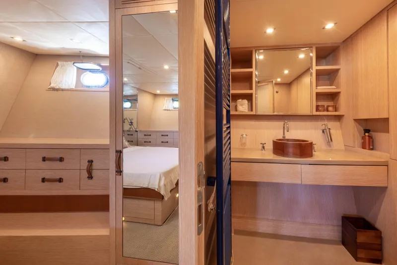  Yacht Photos Pics Luxurious 2006 Mangusta 80 yacht interior with elegant wood finishes and modern amenities.